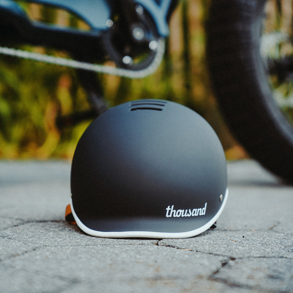 A Black Thousand Brand Bike Helmet